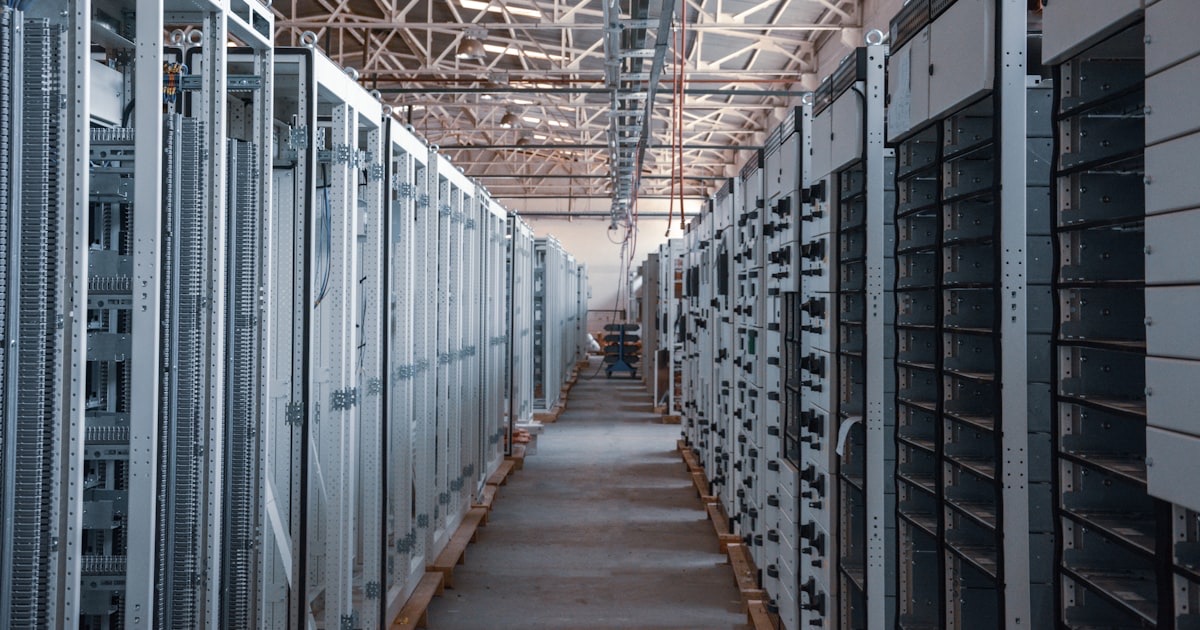 Server rack aisle inside a high-density data center showing dense rack infrastructure at scale